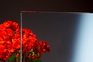 What kind of glass has high transmittance? What kind of glass has low thermal expansion?